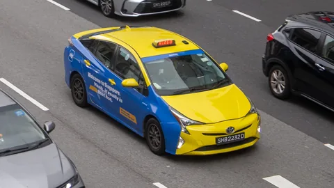 CityCab Toyota Prius wrapped in a Singapore tourism ad
